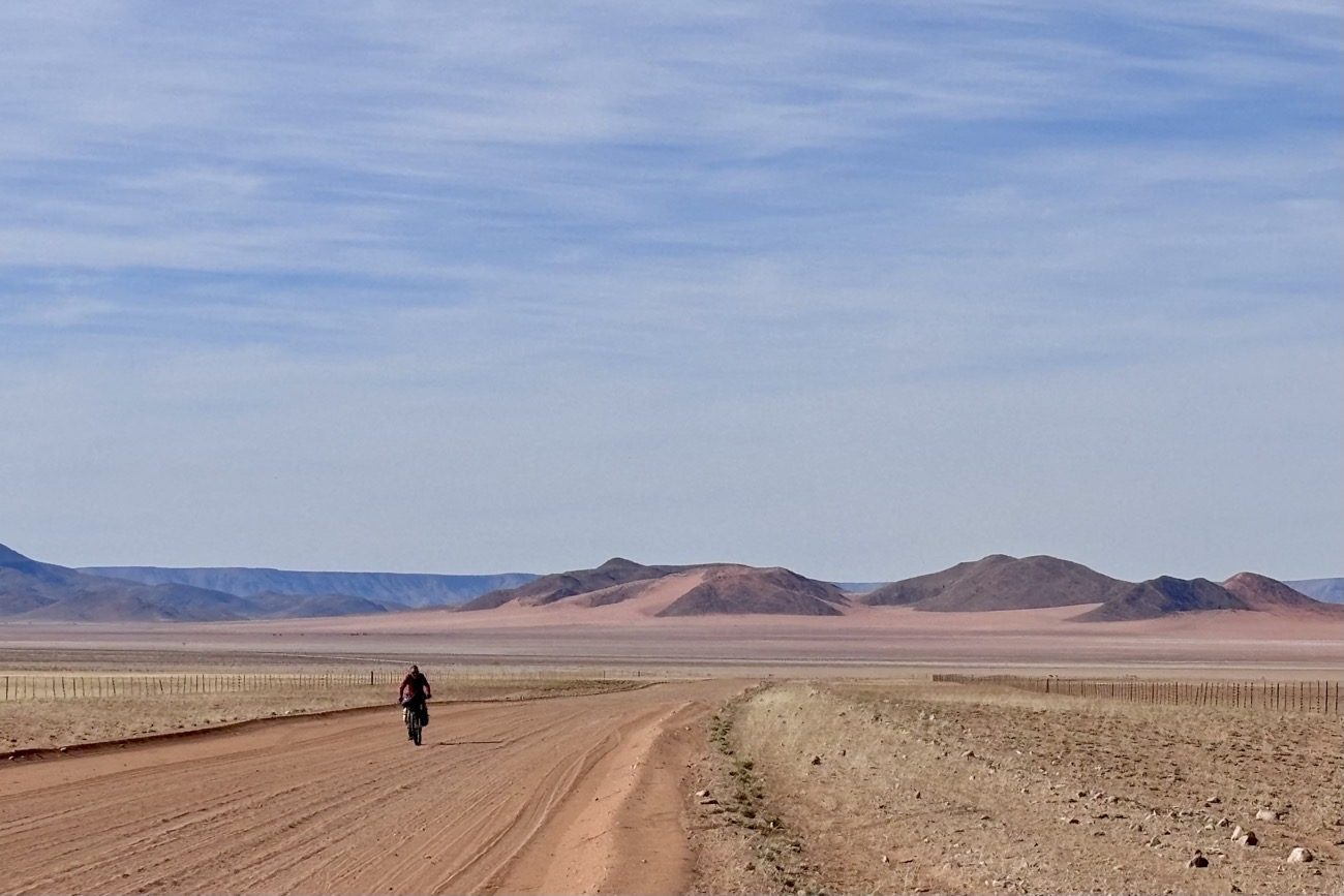 The road separates the Namib desert and the Tirasberg mountains